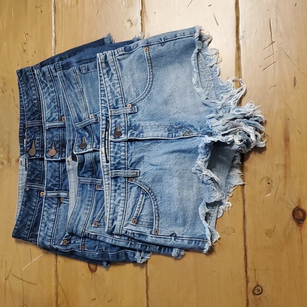 Four pair of volcom denim cut off shorts, all size 27